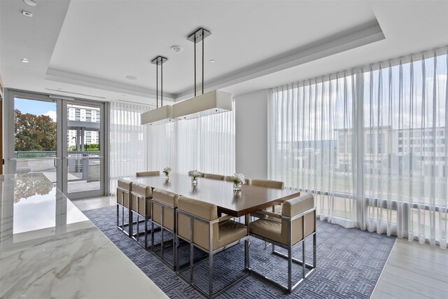 2047 Westcreek Ln Unit 1105, Houston, TX 77027 - dining room featuring a raised ceiling and floor to ceiling windows