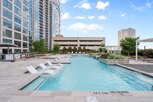 2047 Westcreek Ln Unit 1105, Houston, TX 77027 - community pool featuring a patio