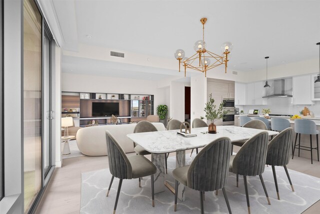2047 Westcreek Ln Unit 1105, Houston, TX 77027 - dining space featuring a chandelier and light wood-type flooring