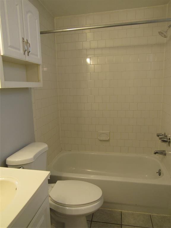 1603 Welch St, Houston, TX 77006 - bathroom with vanity, tile patterned floors, washtub / shower combination, and toilet