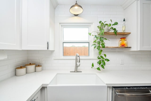 1927 Tabor St, Houston, TX 77009 - kitchen featuring dishwasher, a sink, and tasteful backsplash