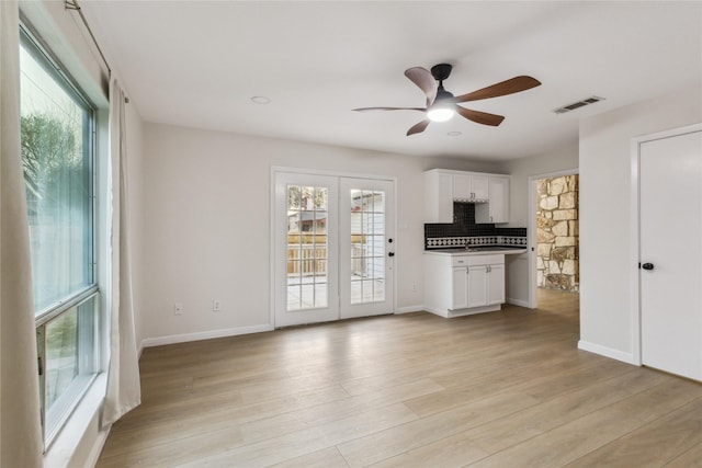 3012 Monument Dr, Round Rock, TX 78681 - unfurnished living room featuring light wood-style floors, a ceiling fan, and baseboards
