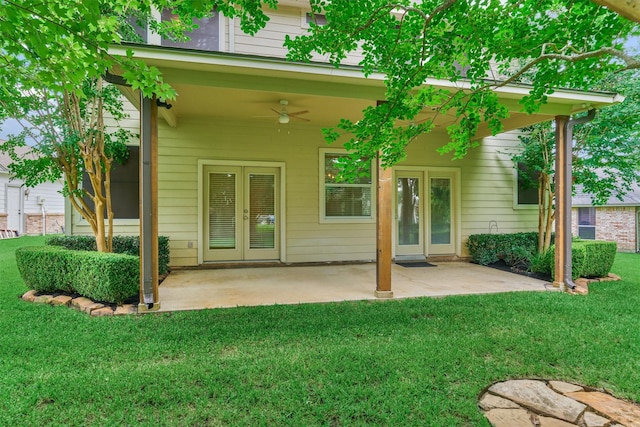 6978 Gentle Breeze Dr, Willis, TX 77318 - back of house featuring a lawn, ceiling fan, a patio area, and french doors