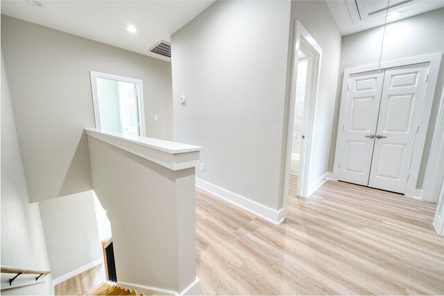 502 W Francis St, Baytown, TX 77520 - hallway with an upstairs landing, attic access, light wood-style floors, baseboards, and recessed lighting