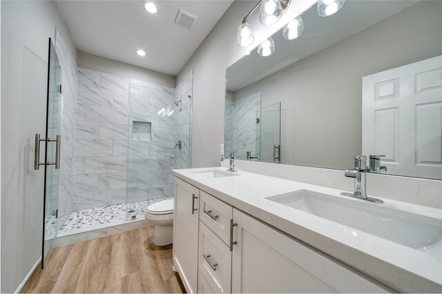 502 W Francis St, Baytown, TX 77520 - full bath with toilet, a shower stall, double vanity, wood finished floors, and recessed lighting