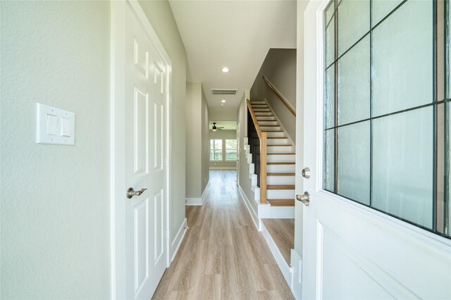502 W Francis St, Baytown, TX 77520 - hallway with light wood-style floors, baseboards, stairs, and recessed lighting