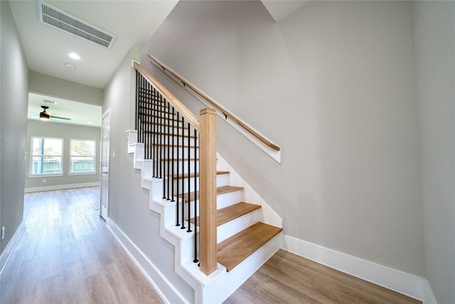 502 W Francis St, Baytown, TX 77520 - stairs featuring wood finished floors, baseboards, and a ceiling fan