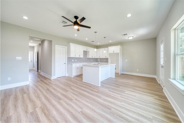 502 W Francis St, Baytown, TX 77520 - kitchen featuring open floor plan, white cabinetry, a ceiling fan, and recessed lighting