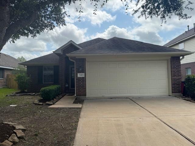5417 Summer Spring Ln, Rosharon, TX 77583 - ranch-style home with driveway, an attached garage, and brick siding
