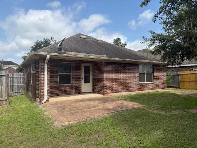 5417 Summer Spring Ln, Rosharon, TX 77583 - rear view of house featuring brick siding, a patio, and roof with shingles