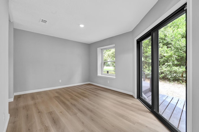 20006 18th Fairway Dr, Humble, TX 77346 - unfurnished room with baseboards, light wood-style floors, and recessed lighting