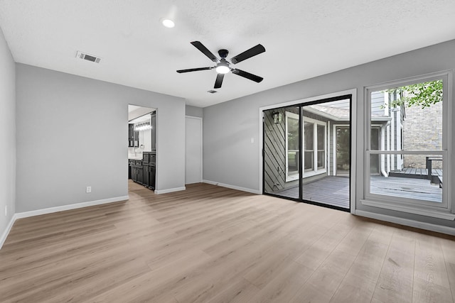 20006 18th Fairway Dr, Humble, TX 77346 - spare room featuring baseboards, light wood-type flooring, and ceiling fan