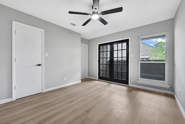 20006 18th Fairway Dr, Humble, TX 77346 - unfurnished room featuring french doors, wood finished floors, baseboards, and a ceiling fan