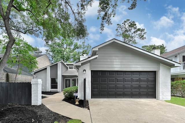 20006 18th Fairway Dr, Humble, TX 77346 - mid-century home with brick siding, a chimney, and driveway