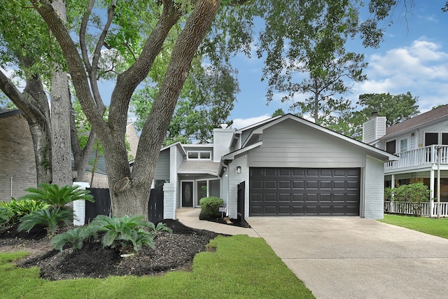 20006 18th Fairway Dr, Humble, TX 77346 - mid-century inspired home with driveway, brick siding, and a garage