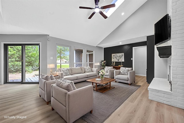 20006 18th Fairway Dr, Humble, TX 77346 - living area with high vaulted ceiling, light wood finished floors, a ceiling fan, plenty of natural light, and recessed lighting