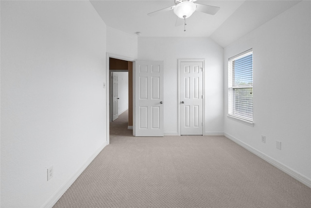 23918 Windsor Canyon Ct, Spring, TX 77389 - unfurnished bedroom with light colored carpet, baseboards, vaulted ceiling, and a ceiling fan