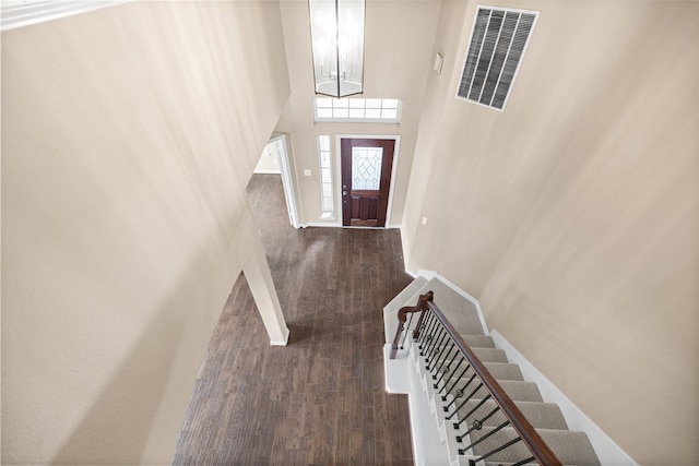23918 Windsor Canyon Ct, Spring, TX 77389 - foyer featuring a chandelier, wood finished floors, stairway, baseboards, and a high ceiling
