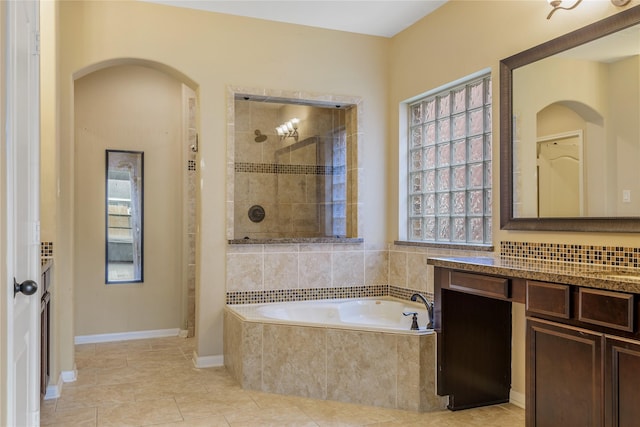 9431 Copper Cove Ln, Rosharon, TX 77583 - bathroom with a garden tub, vanity, tiled shower, and tile patterned flooring