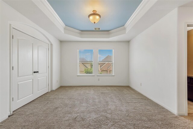 9431 Copper Cove Ln, Rosharon, TX 77583 - unfurnished bedroom with a raised ceiling, carpet, ornamental molding, and baseboards