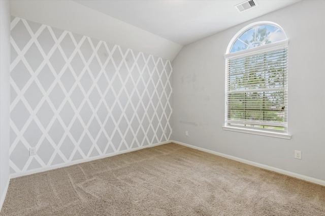 9431 Copper Cove Ln, Rosharon, TX 77583 - carpeted empty room featuring lofted ceiling and baseboards