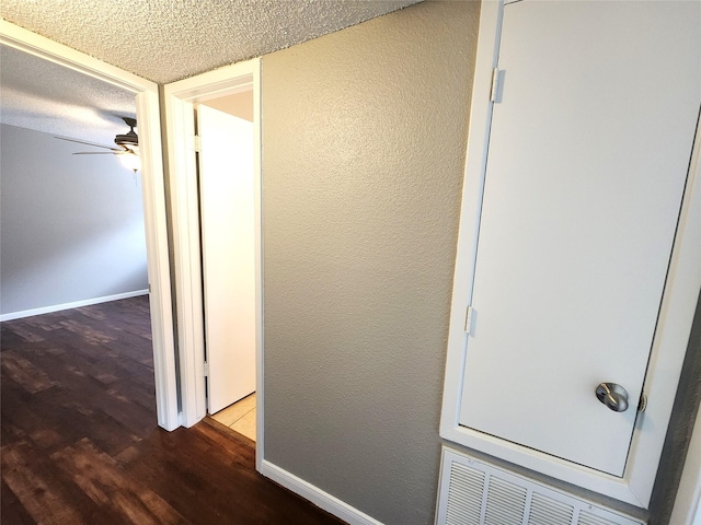 1516 Bay Area Blvd Unit J9, Houston, TX 77058 - hallway with wood finished floors, a textured ceiling, and baseboards