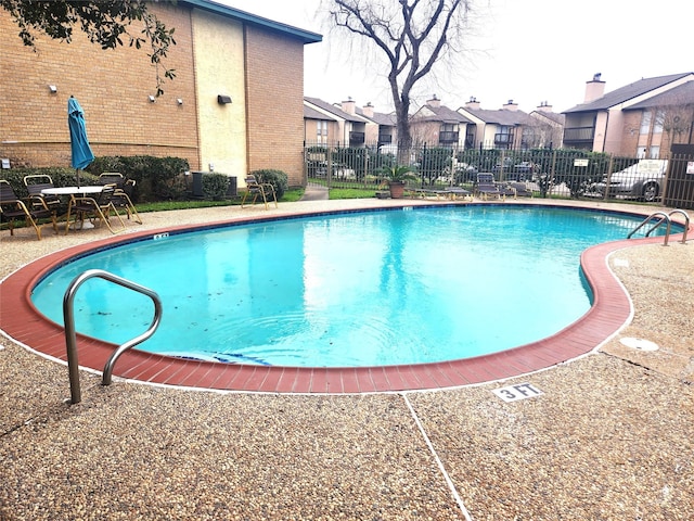 1516 Bay Area Blvd Unit J9, Houston, TX 77058 - community pool featuring a residential view