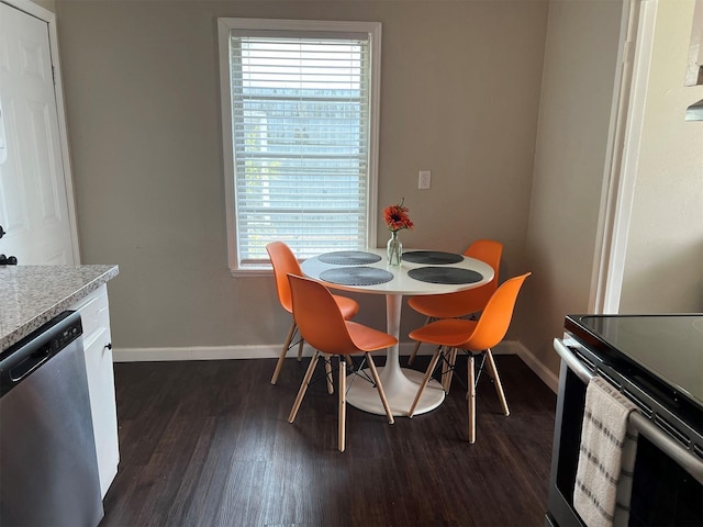 2910 Lavender St, Houston, TX 77026 - dining area featuring baseboards and dark wood-style flooring