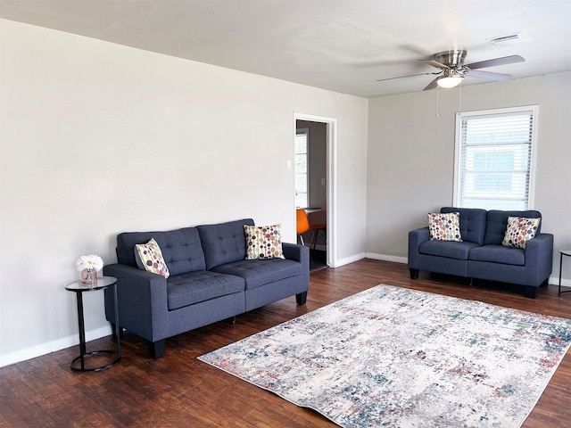 2910 Lavender St, Houston, TX 77026 - living room with a ceiling fan, baseboards, and dark wood-style flooring