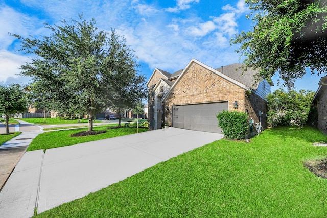 8219 Oxbow Manor Ln, Cypress, TX 77433 - view of home's exterior with a lawn, a garage, driveway, and brick siding