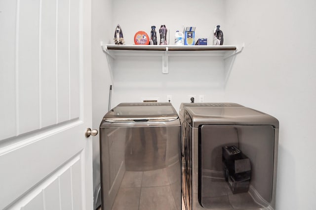 8219 Oxbow Manor Ln, Cypress, TX 77433 - washroom with washing machine and clothes dryer and tile patterned flooring