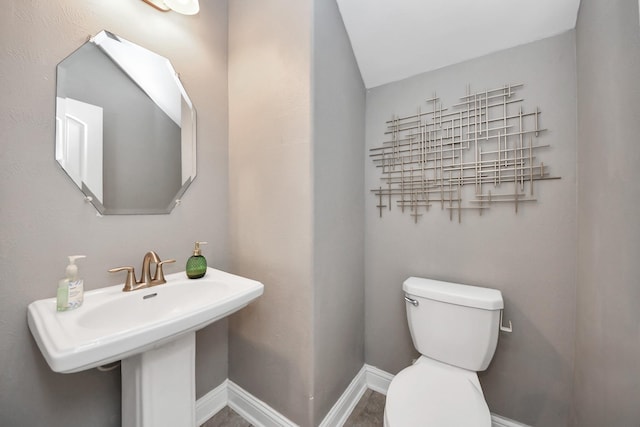 8219 Oxbow Manor Ln, Cypress, TX 77433 - bathroom with toilet, baseboards, and a sink