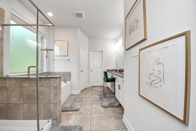 8219 Oxbow Manor Ln, Cypress, TX 77433 - full bath with vanity, a bath, a stall shower, tile patterned floors, and baseboards