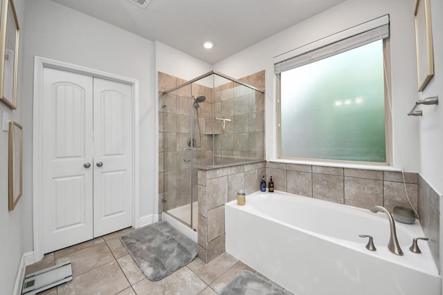 8219 Oxbow Manor Ln, Cypress, TX 77433 - bathroom featuring a bath, a stall shower, and tile patterned floors
