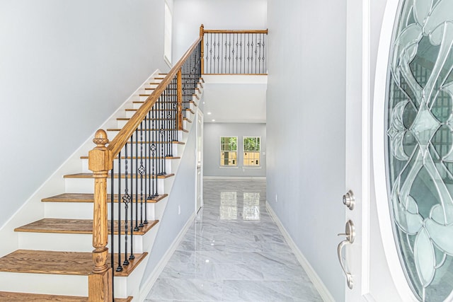 4801 Marquita Ln, Houston, TX 77039 - stairway featuring marble tiled floors and a high ceiling