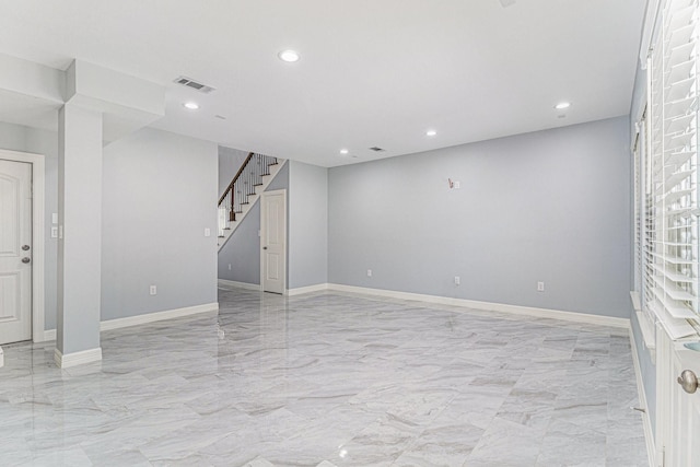 4801 Marquita Ln, Houston, TX 77039 - unfurnished living room with light marble finish flooring, stairway, and recessed lighting