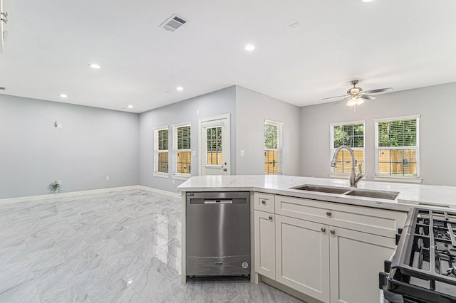 4801 Marquita Ln, Houston, TX 77039 - kitchen featuring stainless steel dishwasher, light marble finish flooring, stove, open floor plan, and ceiling fan