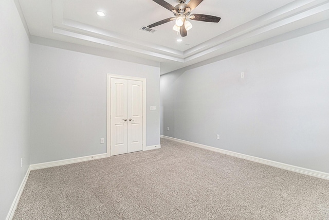 4801 Marquita Ln, Houston, TX 77039 - carpeted empty room featuring ceiling fan, a tray ceiling, and recessed lighting