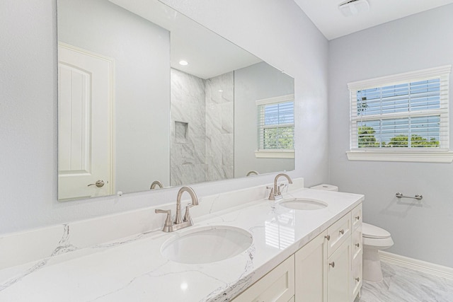 4801 Marquita Ln, Houston, TX 77039 - full bath featuring toilet, double vanity, a marble finish shower, and marble look tile flooring