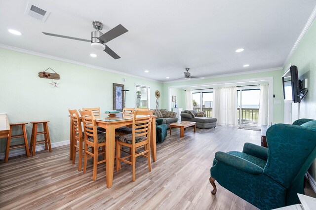 1331 County Road 230, Sargent, TX 77414 - dining area with ceiling fan, plenty of natural light, light wood finished floors, recessed lighting, and crown molding