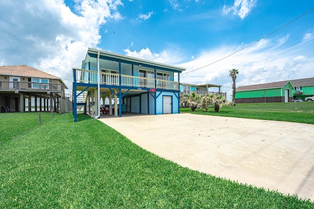 1331 County Road 230, Sargent, TX 77414 - back of house with a carport, driveway, a yard, and a porch