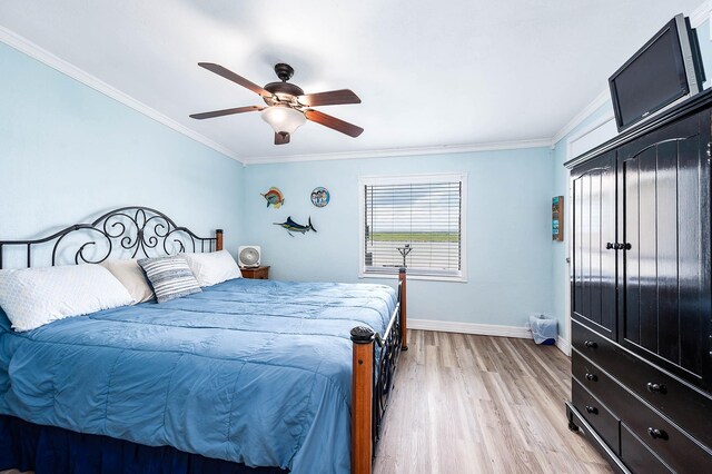 1331 County Road 230, Sargent, TX 77414 - bedroom featuring light wood-style flooring, crown molding, baseboards, and a ceiling fan