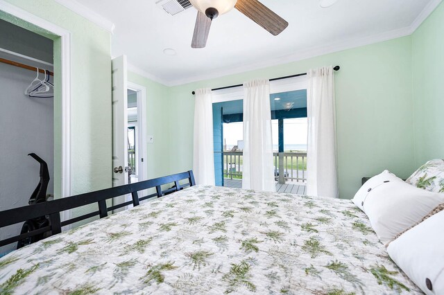 1331 County Road 230, Sargent, TX 77414 - bedroom featuring ornamental molding, a ceiling fan, and access to exterior