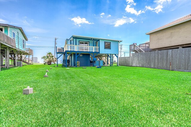 1331 County Road 230, Sargent, TX 77414 - rear view of property featuring stairs and a deck