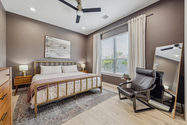 1250 Sampson St, Houston, TX 77003 - bedroom with light wood-style floors, baseboards, a ceiling fan, and recessed lighting