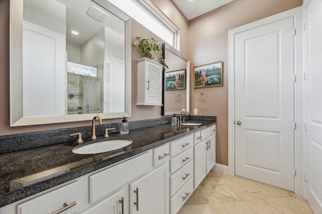 1250 Sampson St, Houston, TX 77003 - bathroom with double vanity, a shower stall, and baseboards