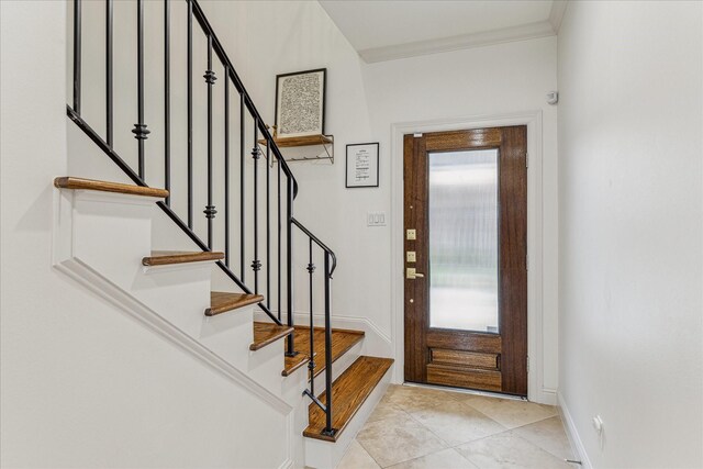 1250 Sampson St, Houston, TX 77003 - foyer featuring baseboards, stairway, and light tile patterned floors