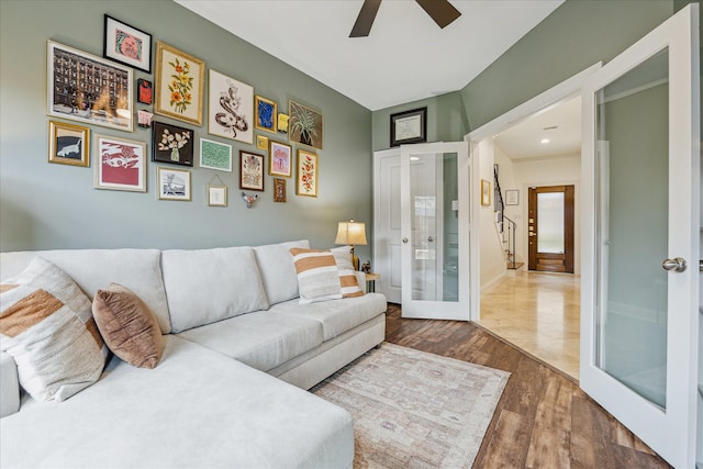 1250 Sampson St, Houston, TX 77003 - living room with wood finished floors, a ceiling fan, french doors, and baseboards
