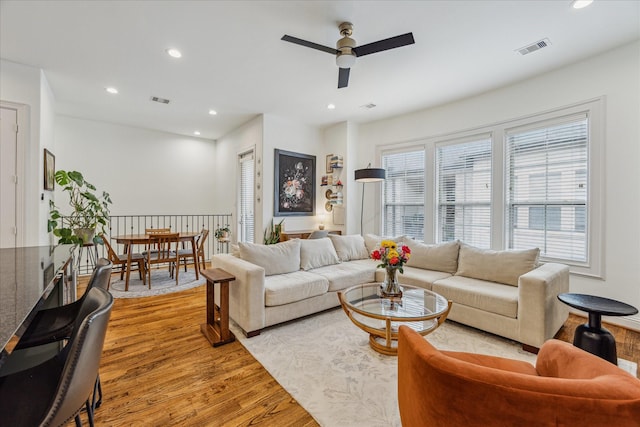 1250 Sampson St, Houston, TX 77003 - living area featuring light wood-style flooring, ceiling fan, and recessed lighting