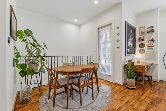 1250 Sampson St, Houston, TX 77003 - dining space featuring light wood-style floors, baseboards, recessed lighting, and an office area